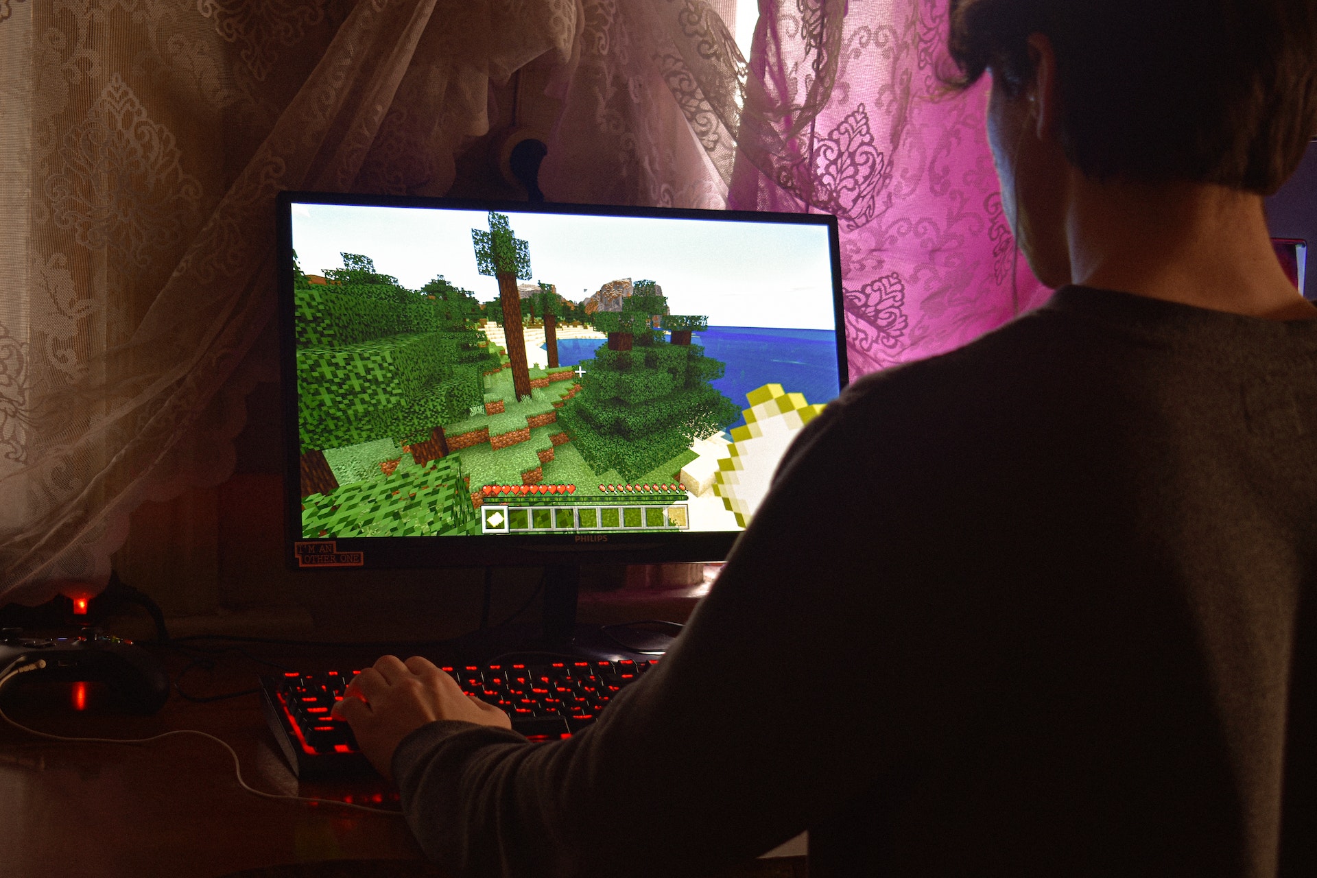 Man with laptop playing game