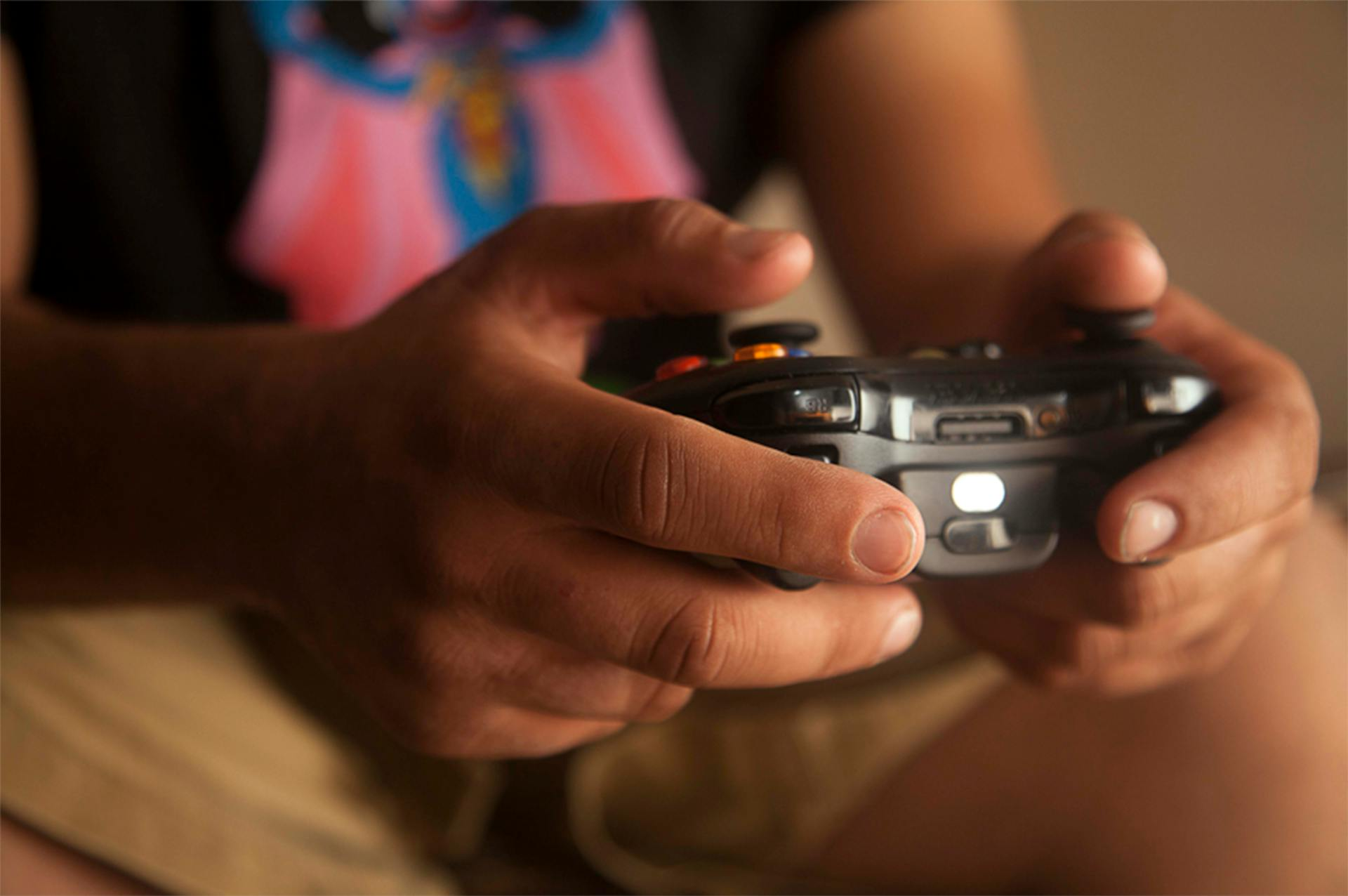 Person holding game controller
