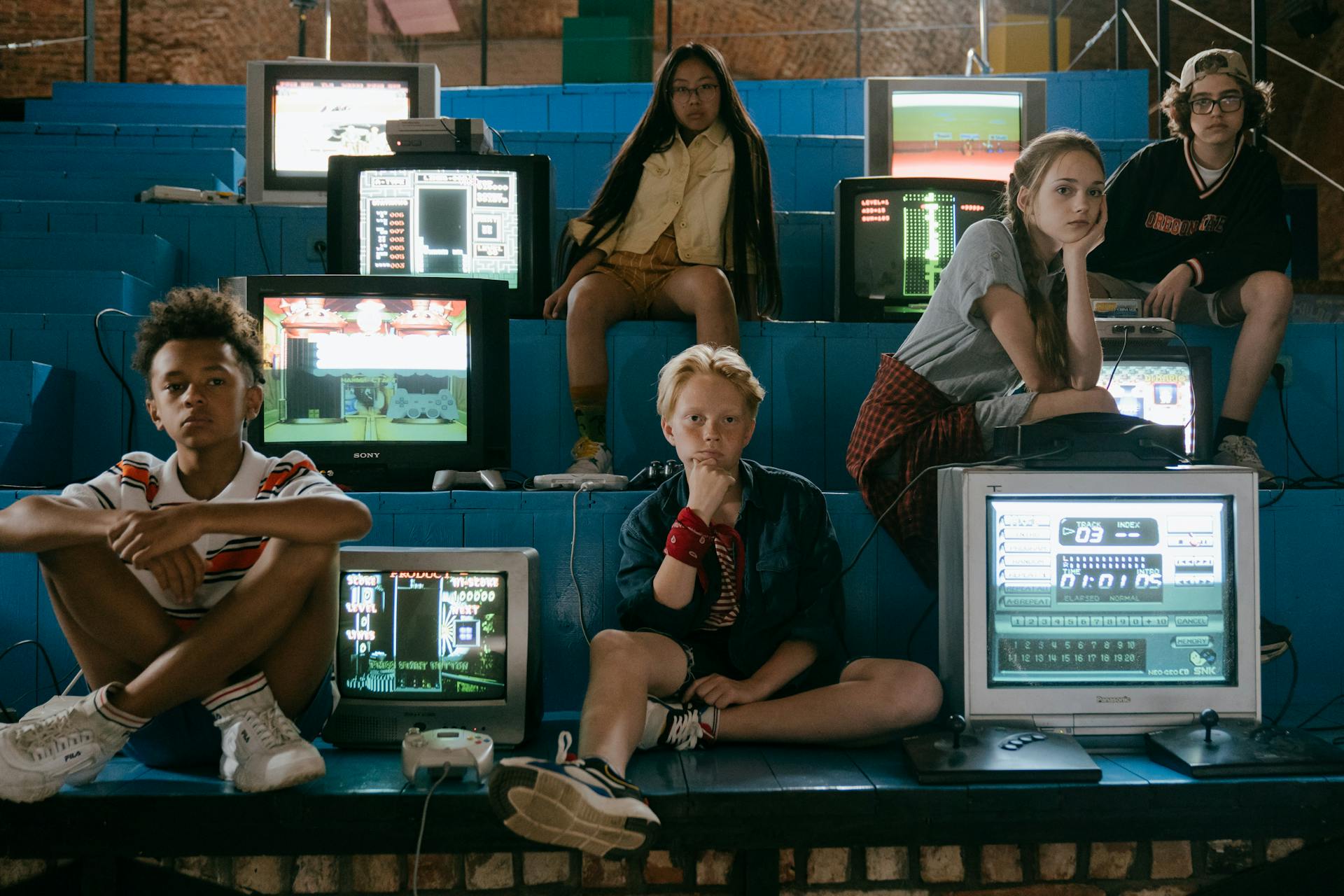 People sitting with retro video games